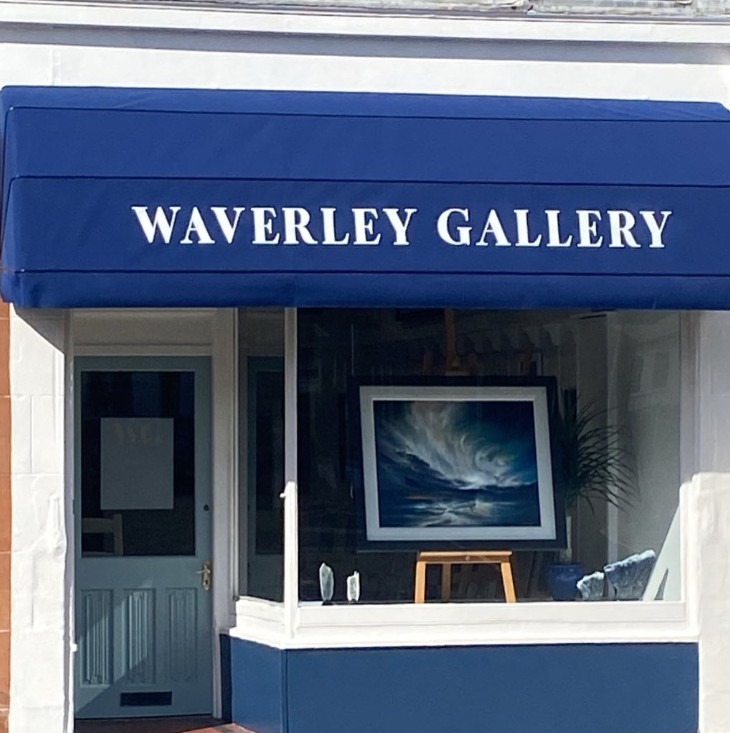 Waverley Gallery shopfront on Main Street, Prestwick, with its navy awning and a seascape on an easel in the window